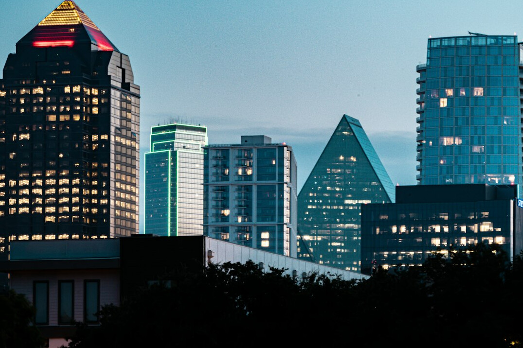 City skyline with modern office towers at dusk