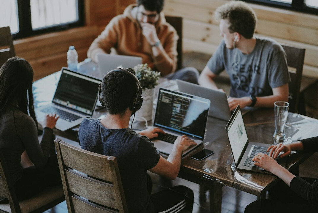 business team discussing code